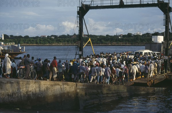 KENYA, Mombasa, Crowds boarding the Likoni ferry.