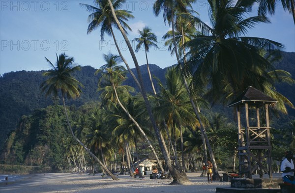 TRINIDAD, Maracas Bay, Palm fringed sandy beach with life guards stand.