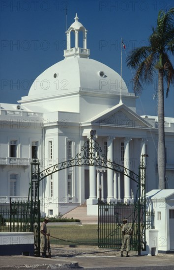 HAITI, Port au Prince, The Presidential Palace.  Detail of white painted exterior with dome and colonnaded entrance.