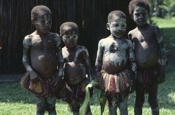 PAPUA NEW GUINEA, Children, Sepik children wearing body paint and grass skirts.
