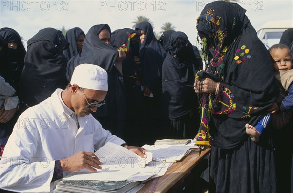 MOROCCO, South, Medical, Doctor visiting oasis comunity south of Zagora to give post natal care and advice to women and children.