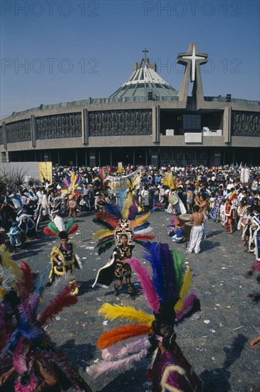 MEXICO, Mexico City, Our Lady of Guadaloupe Festival dancers celebrating outside the Basilica of Guadaloupe