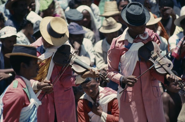 MADAGASCAR, Antananarivo, Traditional folk musicians playing to crowds.