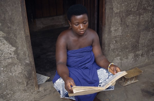 GHANA, Volta Region, A trakosi fetish slave to voodoo priest.  Virgin girls are given to village priests as a way of appeasing the gods for crimes committed by family members.
