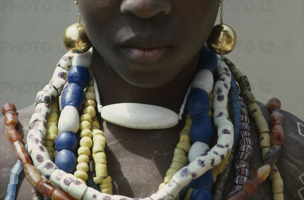 GHANA, Tribal People, Fante girl at dipa initiation ceremony held at onset of menstruation.  Detail of jewellery each girl receives at puberty.