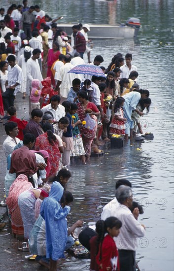 MAURITIUS, People, Crowds making offerings of flowers and fruit in the Grand Bassin lake during the Maha Shivaratree festival in honour of the Hindu god Siva.