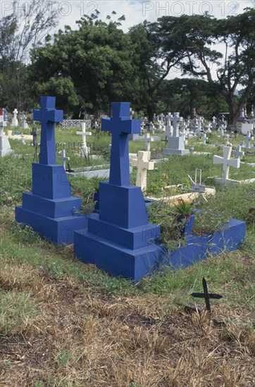 MAURITIUS, Religion, Blue painted crosses for those who died at sea in graveyard near Port Louis.