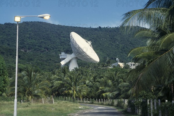 JAMAICA, Media, Satelite earth station. Satelite dish above palm trees.