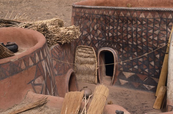 GHANA, North, Architecture, "Newly painted traditional mud architecture with woven straw doors and flat rooves.  Walls painted with abstract geometric patterns in red, black and white."