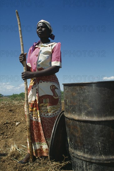 MALAWI, Farming, Female worker on LOMADEF Lipangwe Organic Manure Demonstration Farm using chicken manure on land. Good crop yields are achieved without expensive fertilisers.