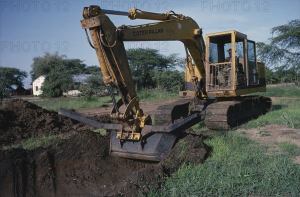 SUDAN, Water, Dutch company ILACO pilot project for drainage canal.  Caterpillar operated by Dinka driver