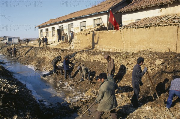 NORTH KOREA, N. Hwanghae Prov., Unpa County, Juche clearing irrigation canal damaged by 1995 floods.