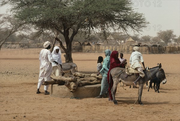 SUDAN, Kordofan, North, Using donkey to help draw water from well.