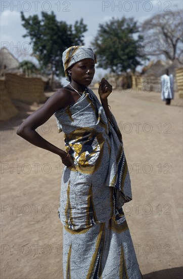 CAMEROON, Rey Bouba, Portrait of girl wearing traditional batik fabric and jewellery.