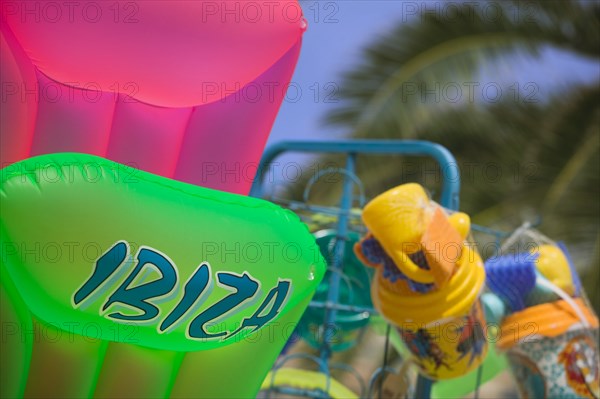 SPAIN, Balearic Islands, Ibiza, "Children's beach toys for sale, lilos and buckets and spades."