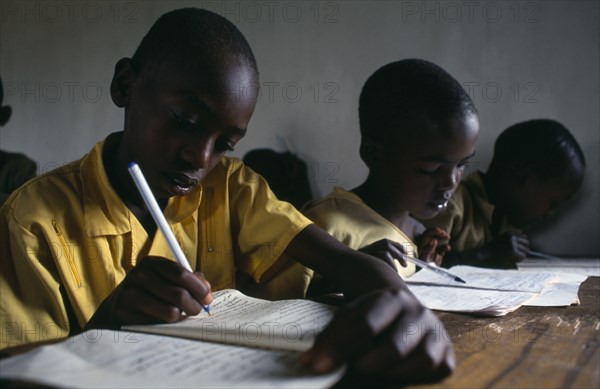 RWANDA, Akagera, Mixed Hutu andTutsi pupils at school.  New classrooms have been built to cope with the influx of Tutsi returnees from Uganda.