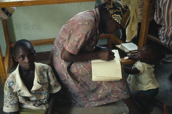 ZIMBABWE, Medical, Trainee village health worker writing notes.