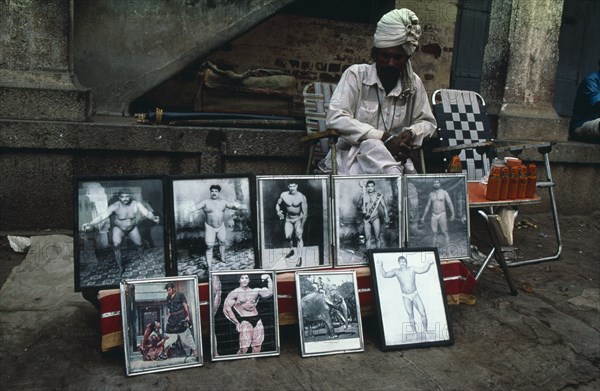 INDIA, Karnataka, Bangalore, Magic elixir seller on street stall.