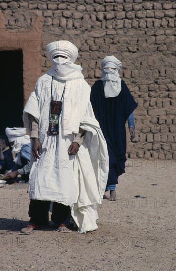 NIGER, People, Men, Two tuareg men dressed in loose cotton robes and head coverings suitable for desert heat.