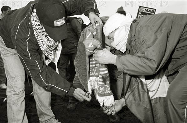 ENGLAND, London, Hyde Park, Islamic protesters burn North American paraphanalia during the One Million March