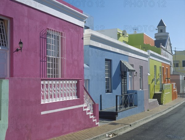 SOUTH AFRICA, Western Cape, Cape Town, Bo Kapp District. Chiappini Street. A row of brightly painted houses in an area famous for its colourful architecture