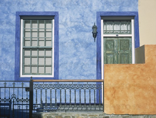 SOUTH AFRICA, Western Cape, Cape Town, Bo Kapp District. Chiappini Street. Brightly painted house frontage with detail of the doors and windows in an area famous for its colourful architecture.