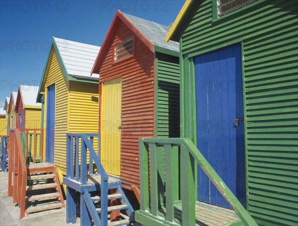 SOUTH AFRICA, Western Cape, Muizenberg, St James Beach. Traditional colourful beach huts.