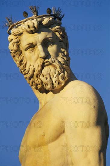 ITALY, Tuscany, Florence, Piazza della Signoria.  Detail of statue of Neptune showing head and upper torso.