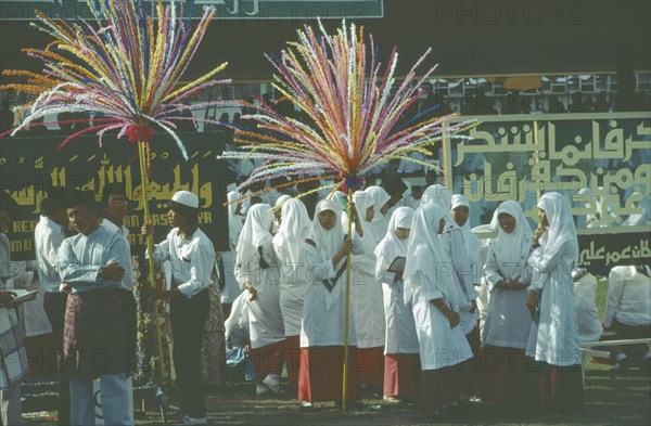 BRUNEI, Bandar Seri Begawan, Women in procession as part of the celebrations for Mohamed’s birthday.