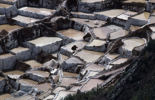 PERU, Cuzco, Salinas, Female worker on salt terraces.