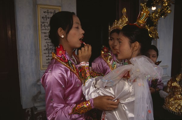 MYANMAR, Mandalay, Funeral dancers putting on make up at the funeral for an Abbot at the Endawya Paya Monastery.