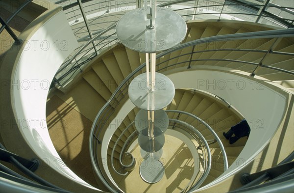 ENGLAND, East Sussex, Bexhill on Sea, De La Warr Pavilion. Interior view looking down the helix like spiral staircase and Bauhaus globe lamps.