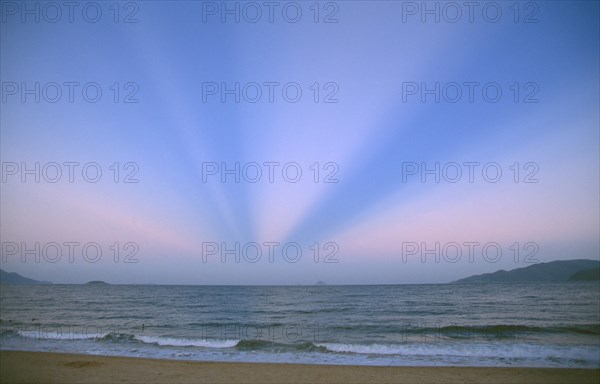 VIETNAM, South, Nha Trang, Unusual atmospheric phenomenon in sky at dusk over sea.