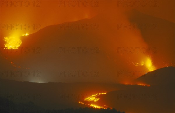 ITALY, Sicily, Mount Etna, Lava flow from the Monti Calcarazzi fissure on the southern flank of Mount Etna and the Piano del Lago cone which destroyed the sapienza cable car in 2001.