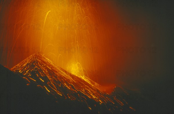 ITALY, Sicily, Stromboli Island, Eruption of Stromboli Volcano at night.