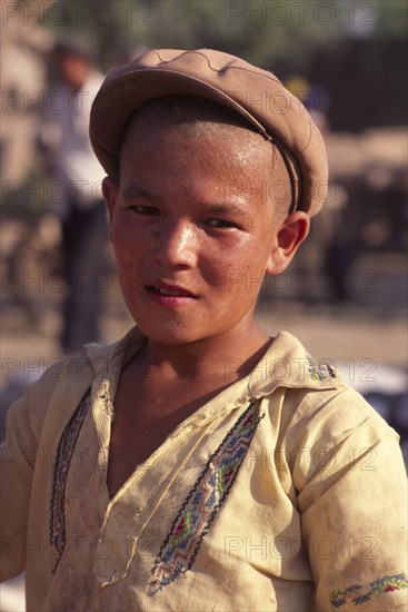 CHINA, Xinjiang Province, Kashgar, Portrait of young Tajik boy