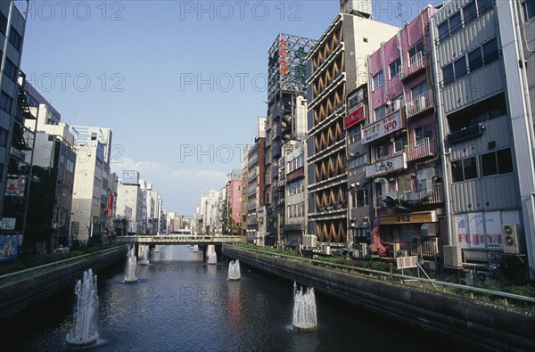 JAPAN, Honshu, Osaka, "Looking east along the Dotonbori River in Minami the city centre theatre, shopping and nightlife district."