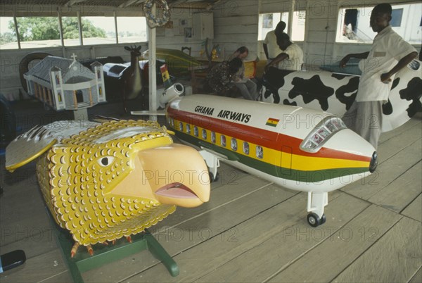 GHANA, Accra, Painted coffins in the shap of a Aeroplane and Eagle.