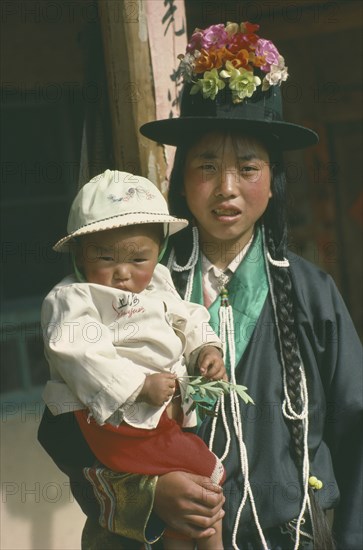 CHINA, Qinghai Province, Huzhu District, Tu minority Yellow Hat Buddhist mother and daughter.