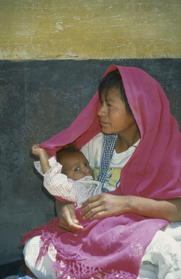 MEXICO, San Miguel de Allende, Mexican Indian mother and child on side street off Plaza Principal.