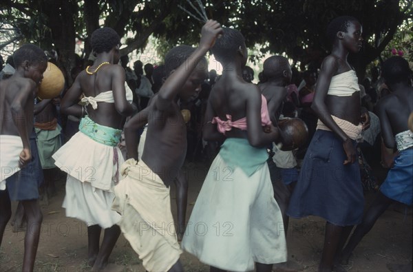 UGANDA, Gulu, Circle of dancing girls.