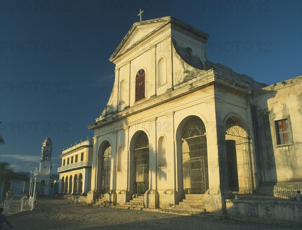 CUBA, Trinidad, SPIRITUS SANCTI , Iglesia Parroquial de la Santisima Trinidad on the Plaza Mayor in the evening light.