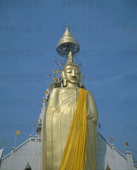 THAILAND, Bangkok, Banglamphu, "Wat Indrawiharn. Standing Buddha wearing orange sash, containing relic of Buddha from Sri Lanka."