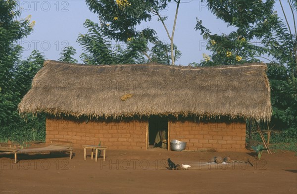 CENTRAL AFRICAN REPUBLIC, Traditional House, Typical roadside dwelling of the Sango Tribe with mud brick walls and thatched roof.