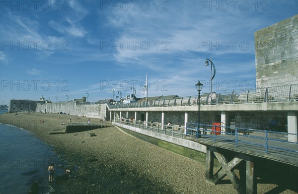 ENGLAND, Hampshire, Portsmouth, Old Portsmouth. View across occupied strectch of beach next to the Walls.