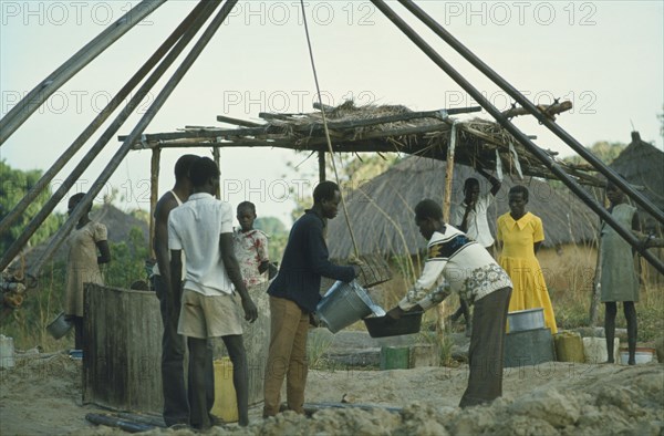 ETHIOPIA, Work, Collecting water at well sunk by International Voluntary Service.