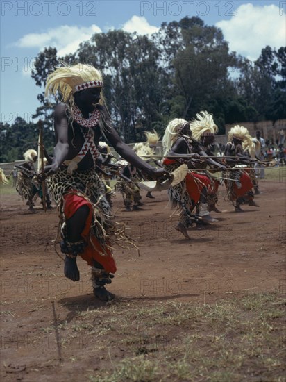 RWANDA, Tutsi, All male traditionally adorned Tutsi intore dancers characterised by coordinated drilling dances reflecting the Tutsi warrior tradition