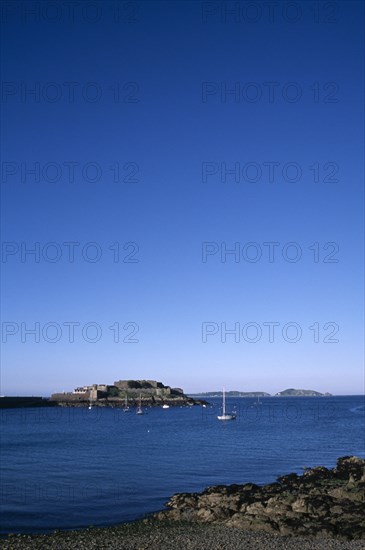 UNITED KINGDOM, Channel Islands, Guernsey, St Peter port. Castle Cornet seen from across water.