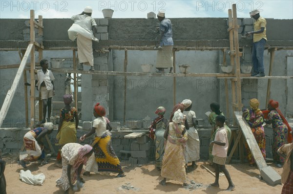 SOMALIA, Work, Settled nomads building houses.