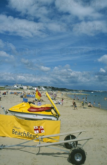 ENGLAND, Dorset, Sandbanks, Lifeboats Beach Rescue banner and Jetski on sandy beach.